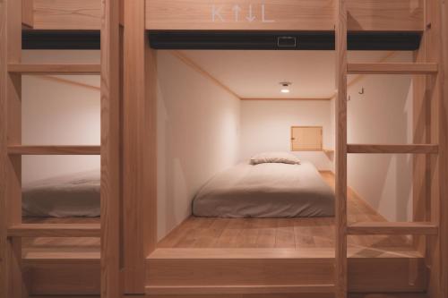 a bedroom with two bunk beds in a room at THY GUEST HOUSE in Ise