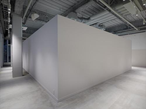 a large white wall in an empty room at HOTEL ANTEROOM NAHA in Naha
