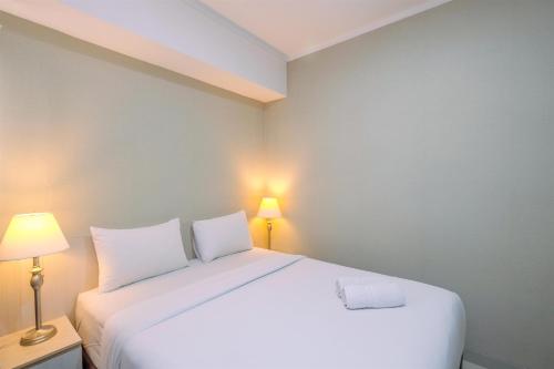 Ein Bett oder Betten in einem Zimmer der Unterkunft Comfortable and Spacious 2BR at Oasis Cikarang Apartment By Travelio