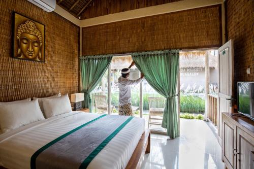 Tempat tidur dalam kamar di Nusa Majesty
