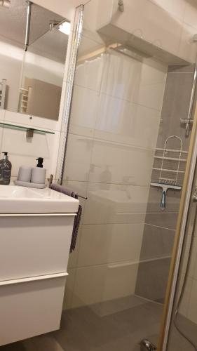 a bathroom with a shower and a sink at Landhaus Hoschek in Scheffau am Wilden Kaiser