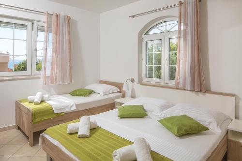 Un ou plusieurs lits dans un hébergement de l'établissement Villa Kristina