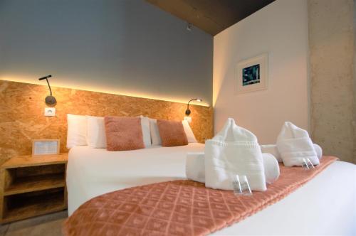 a hotel room with two beds and two lamps at BRICK PALMA - Turismo de Interior in Palma de Mallorca