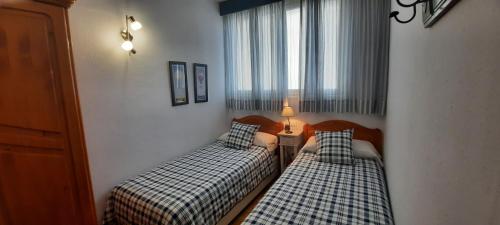 Postel nebo postele na pokoji v ubytování Isamaría Parque Santa Catalina