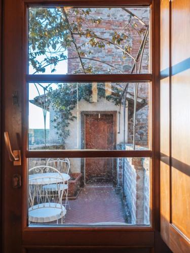 a view from a window of a patio with a table at Abbazia Sette Frati Agriturismo Fratres in Pietrafitta