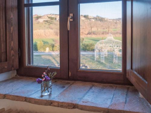 a window with a view of a gazebo seen through it at Abbazia Sette Frati Agriturismo Fratres in Pietrafitta