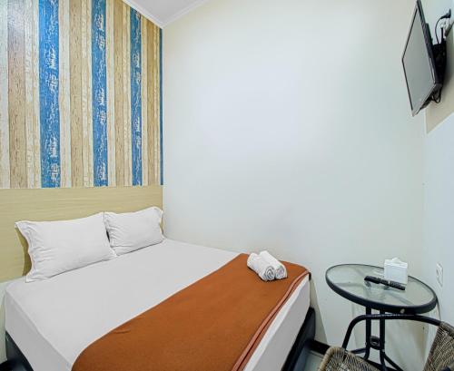 Ένα ή περισσότερα κρεβάτια σε δωμάτιο στο Bantal Guling Alun Alun Bandung
