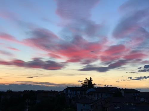 a sunset with red clouds in the sky at Coppo 1829 in Portacomaro
