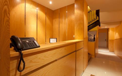 a phone is sitting on a counter in a room at Hotel Mirador Puerta del Sol in Madrid