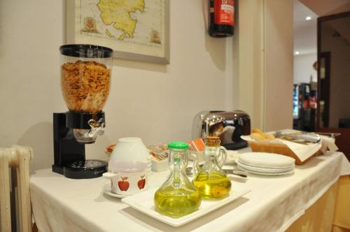 a table with a blender on top of it at Hotel Alguer Camp Nou in Barcelona