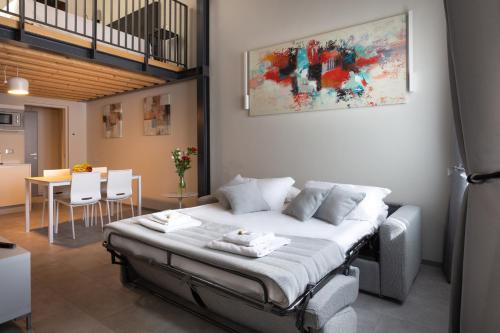 a bedroom with a bed and a dining room at Residence 8 Loft in Venice