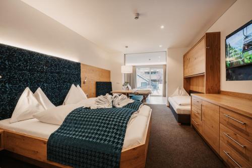 מיטה או מיטות בחדר ב-Alpina Wagrain