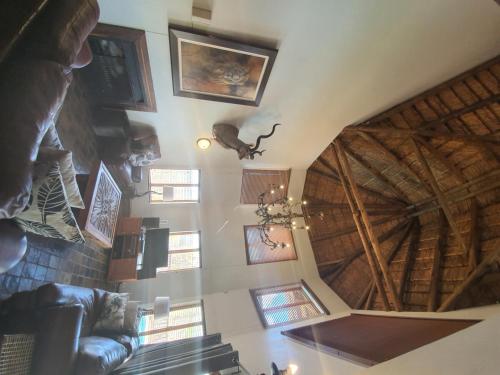 an overhead view of a living room with a wooden ceiling at Hadeda Lodge, Mabalingwe in Warmbaths