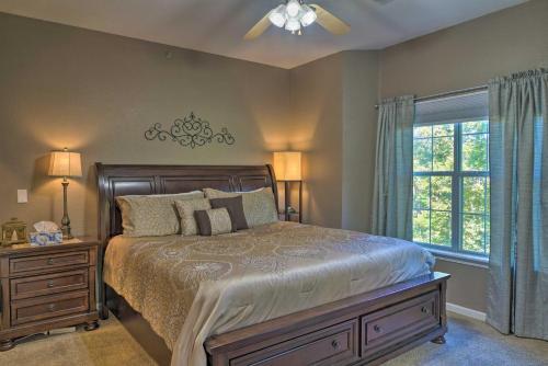 a bedroom with a bed and a window at Resort Condo with Patio, 5 Mi to Branson Landing! in Branson