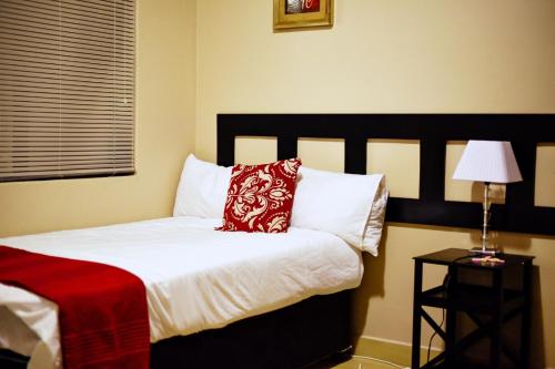 Ένα ή περισσότερα κρεβάτια σε δωμάτιο στο Valleyside Executive Apartments