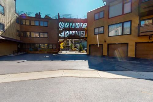 an empty parking lot in front of some buildings at Anaconda 102 in Copper Mountain