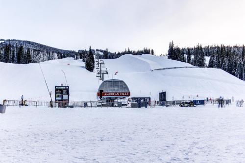 a snow covered ski slope with a ski lift at Summit House East 113 in Copper Mountain