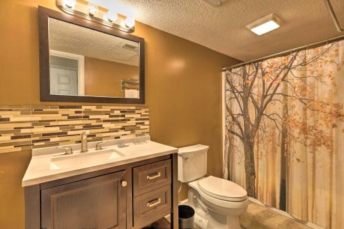 a bathroom with a sink and a toilet and a shower at Year-Round Getaway Less Than 1 Mi to Skiing and Waterpark! in McGaheysville
