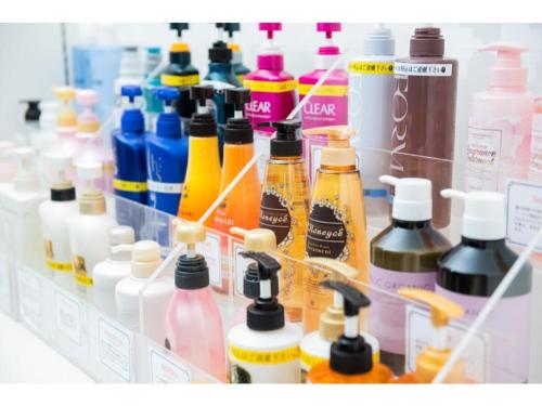 a refrigerator filled with lots of different colored bottles at Kagoshima Plaza Hotel Tenmonkan - Vacation STAY 97891 in Kagoshima