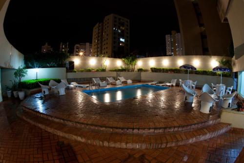 The swimming pool at or close to Harbor Self Buriti Hotel