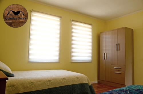 Cama o camas de una habitación en Cabañas Fonck