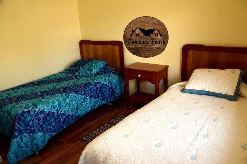 Postel nebo postele na pokoji v ubytování Cabañas Fonck