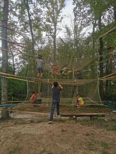 a group of people in a batting cage at Domaine Ecoline in Sadirac