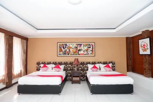 En eller flere senger på et rom på Collection O 908 Taman Wisata Kopeng
