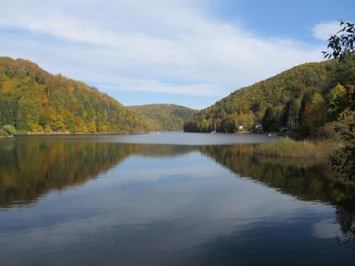 a view of a lake in the mountains at Chata za Górami in Zagórze Śląskie