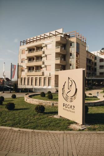 a sign in front of a building at Imperia Apartments in Vrnjačka Banja