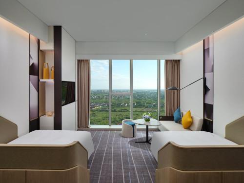 Postel nebo postele na pokoji v ubytování Crowne Plaza Qidong by IHG