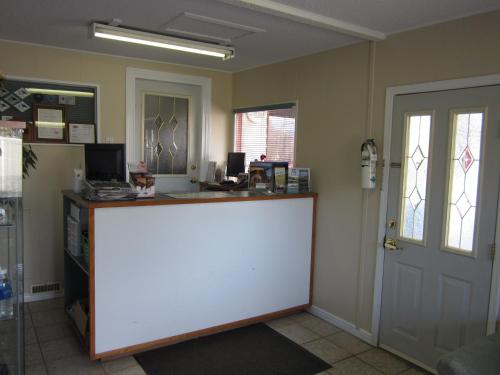 an office with a white counter in a room at Grandview Motel in Kamloops