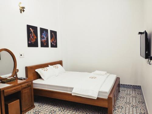 Ένα ή περισσότερα κρεβάτια σε δωμάτιο στο Nhà nghỉ Phúc Anh - Bắc Kạn
