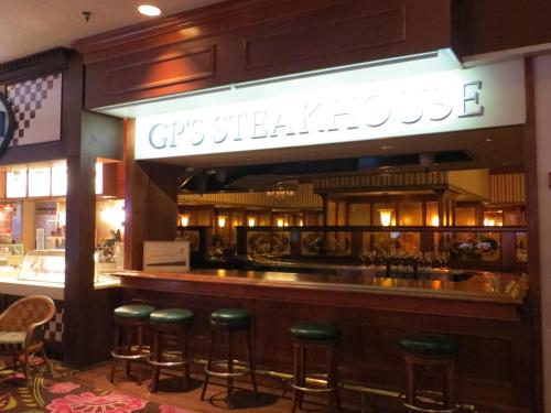 a bar with green stools in a restaurant at Primm Valley Hotel & Casino, a Travelodge by Wyndham in Primm