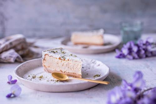 a piece of cake on a plate with a spoon at Apartments Terme Sveti Martin in Sveti Martin na Muri