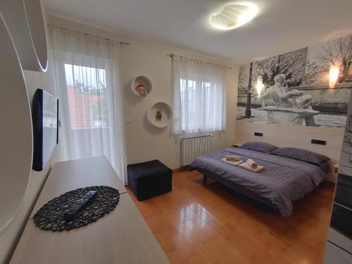 Ένα ή περισσότερα κρεβάτια σε δωμάτιο στο Zagreb Lodge Apartment