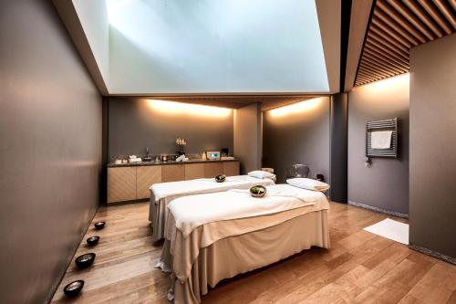 a room with two beds in a room with at Tschuggen Grand Hotel - The Leading Hotels of the World in Arosa