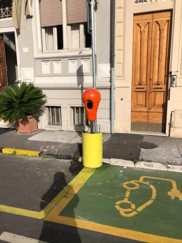 a parking meter on the side of a street at Hotel Lukas Vegetarian & Vegan in Viareggio