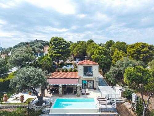 an aerial view of a house with a swimming pool at Nissi View Villa in Vourvourou