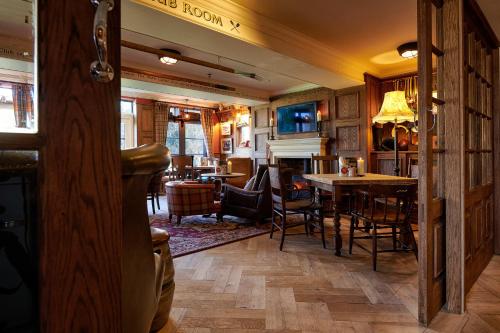 a room with a table and chairs and a dining room at The Boathouse in Bath