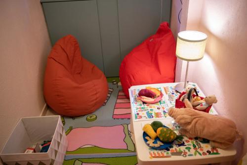 a childs room with a bed and a table with toys at Dandy Villas Nymfaio - Snow Fairy - Sauna in Nimfaíon