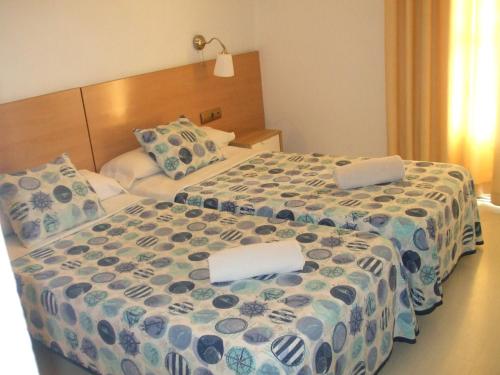 Postel nebo postele na pokoji v ubytování Hostal Felipe 2
