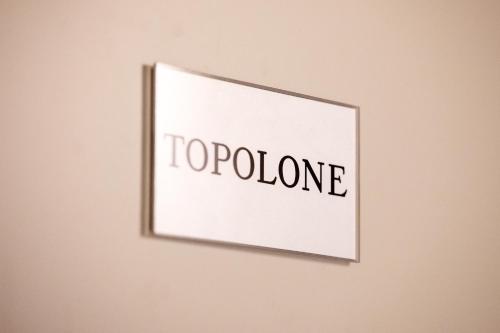 a picture on a wall with the words topoline at B&B il Barbero in Siena