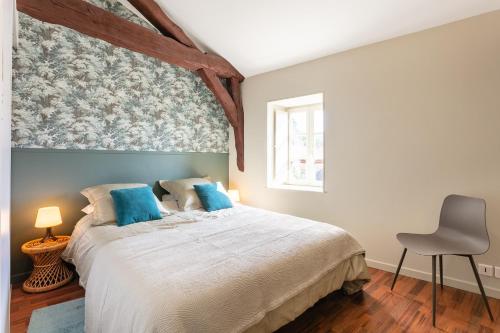 Postel nebo postele na pokoji v ubytování Les Toits de Marceau, Cœur cité historique Sarlat