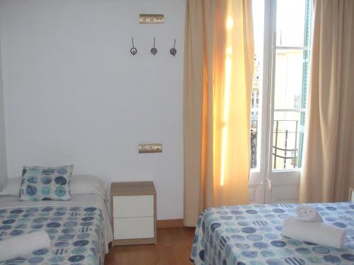 Postel nebo postele na pokoji v ubytování Hostal Felipe 2