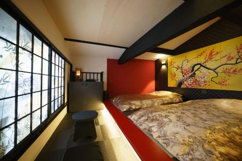 En eller flere senger på et rom på Kakureyado Fujikawaguchiko