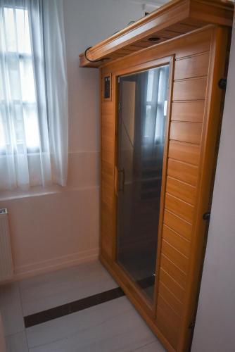 a glass door in a room with a window at Villa Campana in Siófok