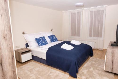 Säng eller sängar i ett rum på Kincses Sziget Apartman