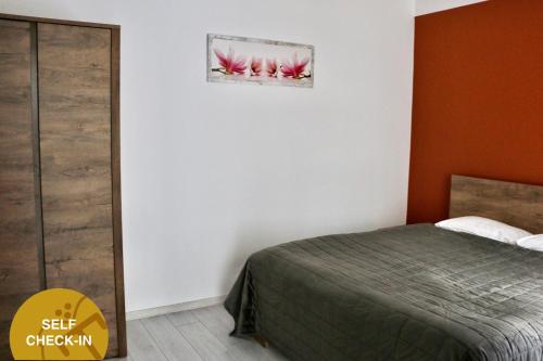 Кровать или кровати в номере Apartments Moravská 24