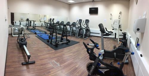 a gym with several treadmills and exercise bikes at CIM Business Centre in Maidenhead
